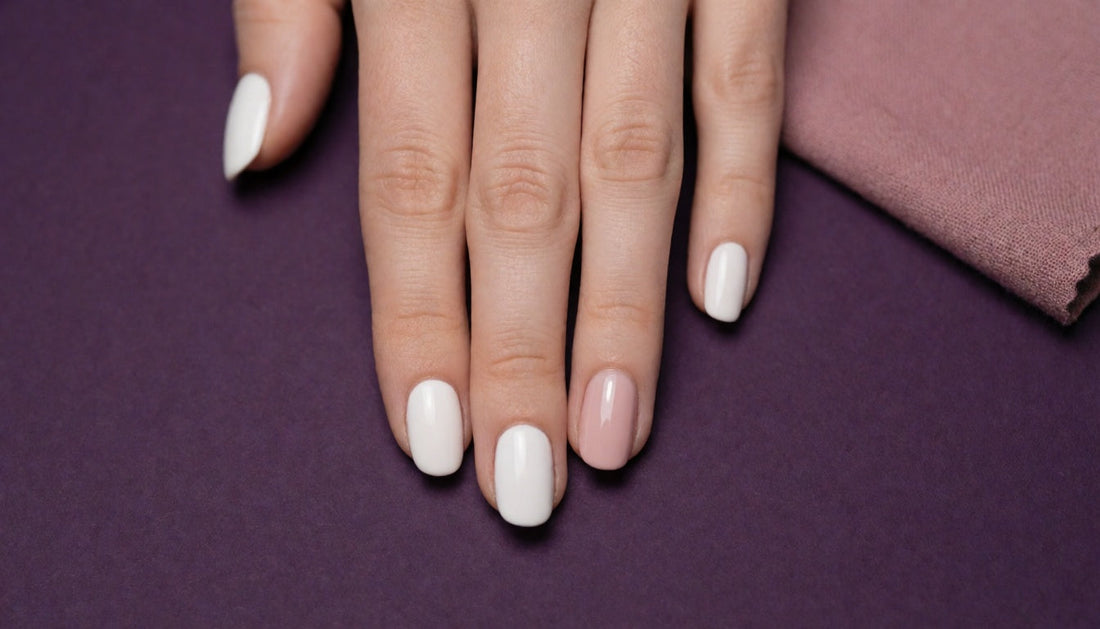 Hand showing gel polish peeling away from one nail beside healthy, adhered gel